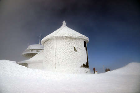 KARPACZ, POLAND - MARCH 08, 2020: St. Lawrence's Chapel in the Winter. A Roman Catholic chapel located on the peak of Sniezka mountain (1602 m. above sea level), Giant Mountains, Poland, Europe.のeditorial素材