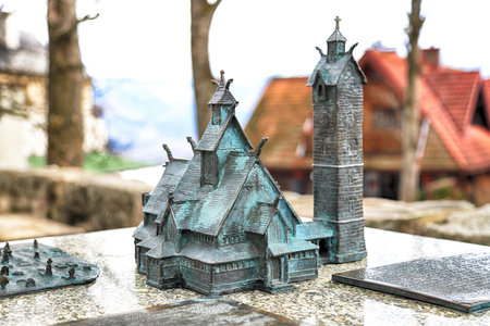 KARPACZ, POLAND - MARCH 09, 2020: Bronze miniature of the old wooden temple Vang (Wang). Medieval...