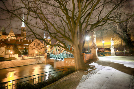 WROCLAW, POLAND - MARCH 10, 2020: Night view of the Tumski Bridge on Cathedral Island, oldest part...