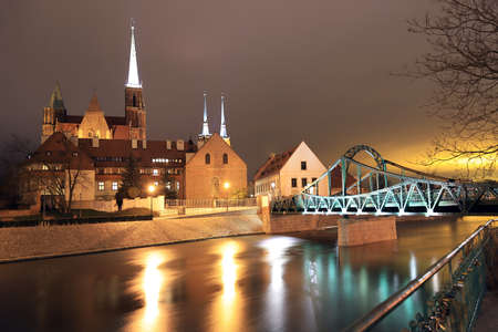 WROCLAW, POLAND - MARCH 10, 2020: Night view of the Tumski Bridge on Cathedral Island, oldest part of the city, Wroclaw, Poland, Europe.のeditorial素材