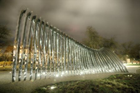 WROCLAW, POLAND - MARCH 10, 2020: Night view of the NAWA sculpture designed by Oskar Zieta, erected on Daliowa Island. Due to polished steel surface NAWA reflects its surroundings.のeditorial素材