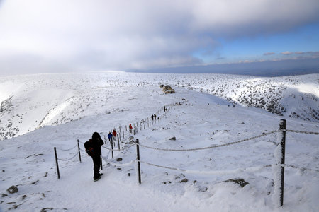 KARPACZ, POLAND - MARCH 08, 2020: Winter view from Sniezka mountain (1602 m. above sea level). In the background the Dom Slaski mountain shelter. Giant Mountains, Poland, Europe.のeditorial素材