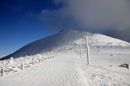 KARPACZ, POLAND - MARCH 08, 2020: Snezka or Sniezka (in Czech and Polish) is a mountain on the border between the Czech Republic and Poland. Winter landscape. Giant Mountains, Poland, Europe.のeditorial素材