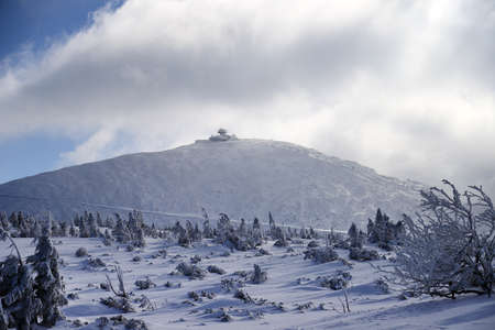 KARPACZ, POLAND - MARCH 08, 2020: Snezka or Sniezka (in Czech and Polish) is a mountain on the border between the Czech Republic and Poland. Winter landscape. Giant Mountains, Poland, Europe.のeditorial素材