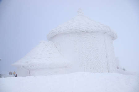 KARPACZ, POLAND - MARCH 08, 2020: St. Lawrence's Chapel in the Winter. A Roman Catholic chapel located on the peak of Sniezka mountain (1602 m. above sea level), Giant Mountains, Poland, Europe.のeditorial素材