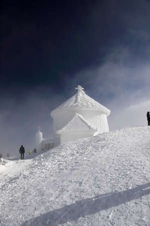 KARPACZ, POLAND - MARCH 08, 2020: St. Lawrence's Chapel in the Winter. A Roman Catholic chapel located on the peak of Sniezka mountain (1602 m. above sea level), Giant Mountains, Poland, Europe.のeditorial素材