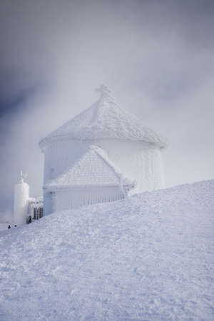 KARPACZ, POLAND - MARCH 08, 2020: St. Lawrence's Chapel in the Winter. A Roman Catholic chapel located on the peak of Sniezka mountain (1602 m. above sea level), Giant Mountains, Poland, Europe.のeditorial素材
