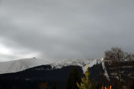 KARPACZ, POLAND - MARCH 08, 2020: Night view of the Giant Mountains with the highest peak - Sniezka (1602 m. above sea level). Winter landscape. Karpacz, Poland, Europe.のeditorial素材