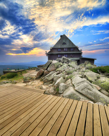 SZKLARSKA POREBA, POLAND - AUGUST 10, 2020: Szrenica mountain shelter (1362 m above sea level) during sunset, Szklarska Poreba, Poland, Europe.のeditorial素材