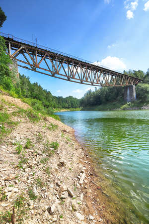 PILCHOWICE, POLAND - AUGUST 12, 2020: Railway bridge over Pilchowice Lake, which was supposed to be blown up for the filming of "Mission Impossible 7", Pilchowice, Poland, Europe.のeditorial素材