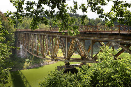 PILCHOWICE, POLAND - AUGUST 12, 2020: Railway bridge over Pilchowice Lake, which was supposed to be blown up for the filming of "Mission Impossible 7", Pilchowice, Poland, Europe.のeditorial素材
