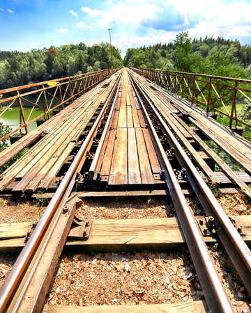 PILCHOWICE, POLAND - AUGUST 12, 2020: Railway bridge over Pilchowice Lake, which was supposed to be blown up for the filming of "Mission Impossible 7", Pilchowice, Poland, Europe.のeditorial素材