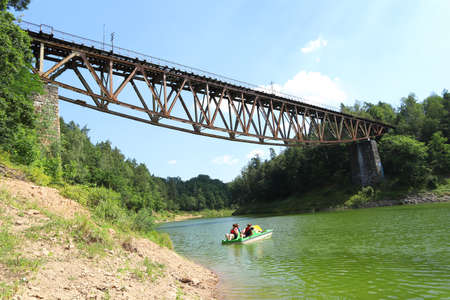 PILCHOWICE, POLAND - AUGUST 12, 2020: Railway bridge over Pilchowice Lake, which was supposed to be blown up for the filming of "Mission Impossible 7", Pilchowice, Poland, Europe.のeditorial素材