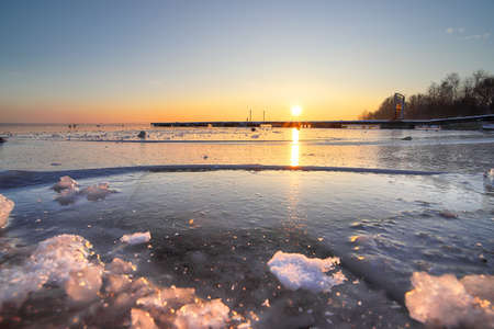 A beautiful sunset over  frozen Mietkow Lake, during extremely low temperatures. Mietkow near Wroclaw, Poland, Europe.の写真素材