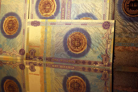 A physical version of Bitcoin in the form of banknotes. A conceptual image for investors in the fast-growing cryptocurrency and blockchain technology market.の写真素材