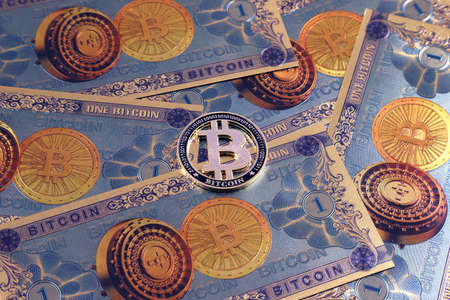 A physical version of Bitcoin in the form of coins and banknotes. A conceptual image for investors in the fast-growing cryptocurrency and blockchain technology market.の写真素材