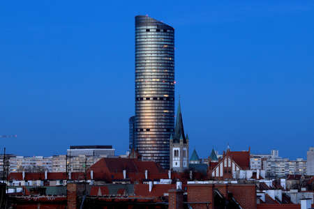 WROCLAW, POLAND - APRIL 04, 2021: Sky Tower, the tallest residential building in Poland (212m), just after sunset. A unique architectural project in Wroclaw, Poland, Europe.のeditorial素材