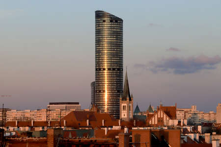 WROCLAW, POLAND - APRIL 04, 2021: Sky Tower, the tallest residential building in Poland (212m), during sunset. A unique architectural project in Wroclaw, Poland, Europe.のeditorial素材