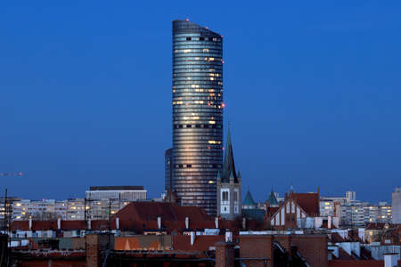 WROCLAW, POLAND - APRIL 04, 2021: Sky Tower, the tallest residential building in Poland (212m), just after sunset. A unique architectural project in Wroclaw, Poland, Europe.のeditorial素材