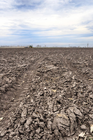 Preparing field for planting. Plowed soil in spring time.の写真素材