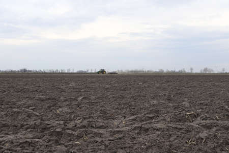 Preparing field for planting. Plowed soil in spring time.の写真素材