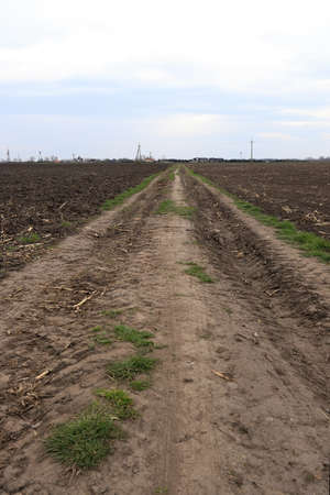 Preparing field for planting. Plowed soil in spring time.の写真素材