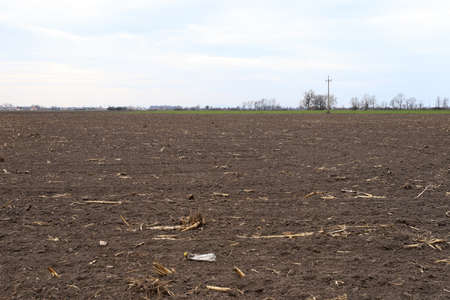 Preparing field for planting. Plowed soil in spring time.の写真素材