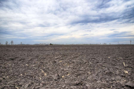Preparing field for planting. Plowed soil in spring time.の写真素材