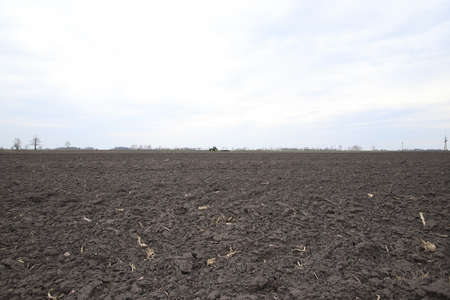 Preparing field for planting. Plowed soil in spring time.の写真素材