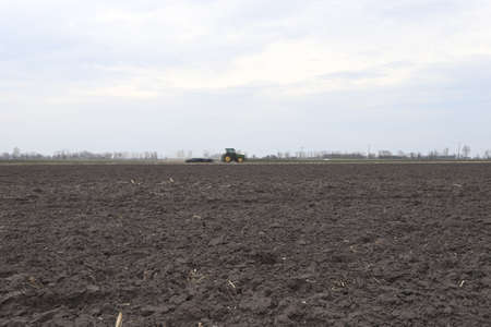 Preparing field for planting. Plowed soil in spring time.の写真素材