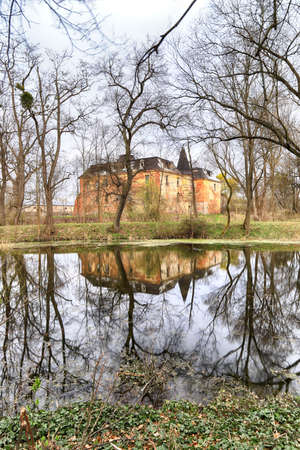 WROCLAW, POLAND - APRIL 11, 2021: Palace in Komorowice near Wroclaw, Poland. Beautiful palace park at the beginning of spring.のeditorial素材