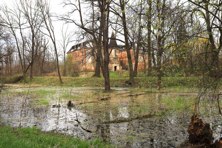 WROCLAW, POLAND - APRIL 11, 2021: Palace in Komorowice near Wroclaw, Poland. Beautiful palace park at the beginning of spring.のeditorial素材