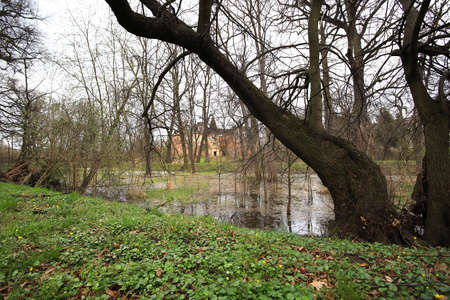 WROCLAW, POLAND - APRIL 11, 2021: Palace in Komorowice near Wroclaw, Poland. Beautiful palace park at the beginning of spring.のeditorial素材