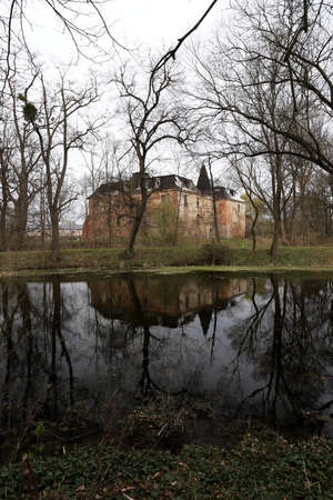 WROCLAW, POLAND - APRIL 11, 2021: Palace in Komorowice near Wroclaw, Poland. Beautiful palace park at the beginning of spring.のeditorial素材