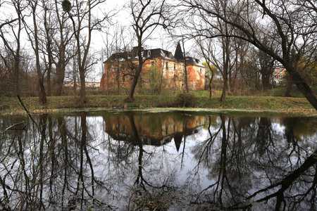 WROCLAW, POLAND - APRIL 11, 2021: Palace in Komorowice near Wroclaw, Poland. Beautiful palace park at the beginning of spring.のeditorial素材