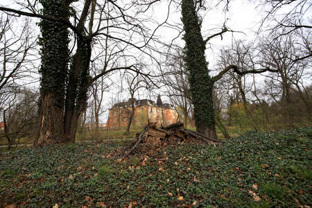 WROCLAW, POLAND - APRIL 11, 2021: Palace in Komorowice near Wroclaw, Poland. Beautiful palace park at the beginning of spring.のeditorial素材