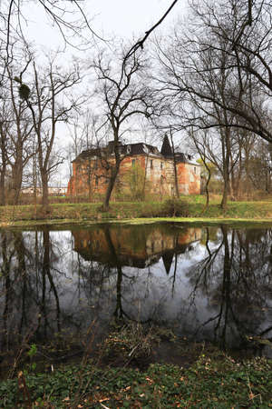 WROCLAW, POLAND - APRIL 11, 2021: Palace in Komorowice near Wroclaw, Poland. Beautiful palace park at the beginning of spring.のeditorial素材