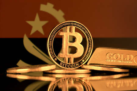 Physical version of Bitcoin, gold bar and Angola Flag.の写真素材