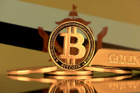 Physical version of Bitcoin, gold bar and Brunei Flag.の写真素材