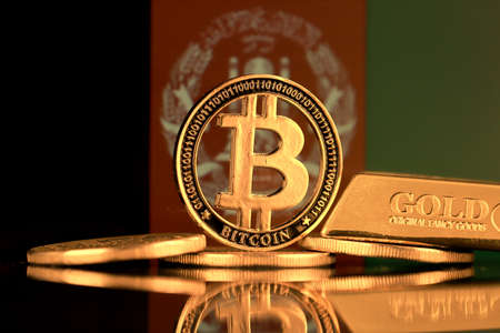 Physical version of Bitcoin, gold bar and Afghanistan Flag.の写真素材