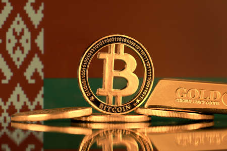 Physical version of Bitcoin, gold bar and Belarus Flag.の写真素材