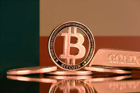 Physical version of Bitcoin, gold bar and Benin Flag.の写真素材