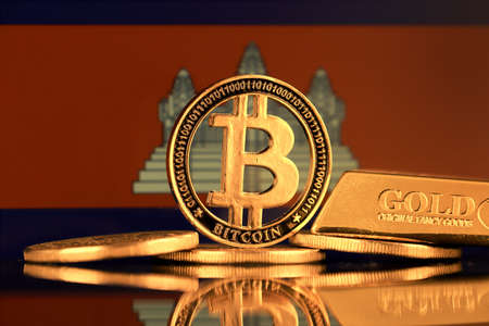 Physical version of Bitcoin, gold bar and Cambodia Flag.の写真素材