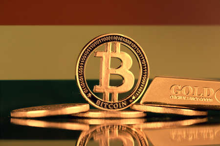 Physical version of Bitcoin, gold bar and Bolivia Flag.の写真素材