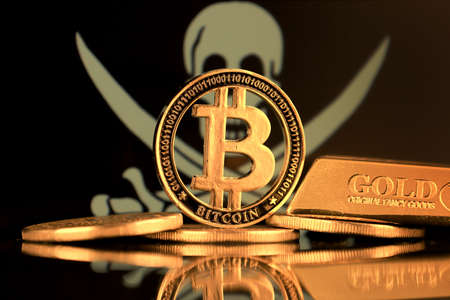 Physical version of Bitcoin, gold bar and Pirate Flag. Conceptual image for investors in cryptocurrency and Blockchain Technology. Risk, safety and security.の写真素材