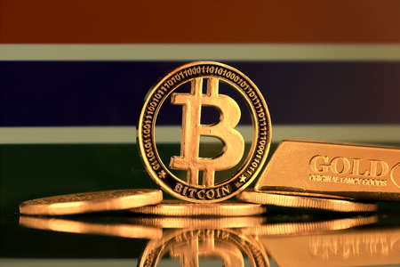 Physical version of Bitcoin, gold bar and Gambia Flag.の写真素材