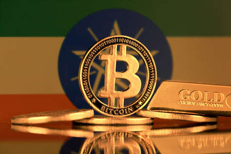 Physical version of Bitcoin, gold bar and Ethiopia Flag.の写真素材