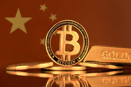 Physical version of Bitcoin, gold bar and China Flag.の写真素材
