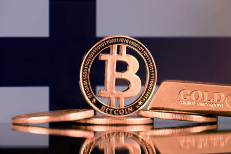 Physical version of Bitcoin, gold bar and Finland Flag.の写真素材