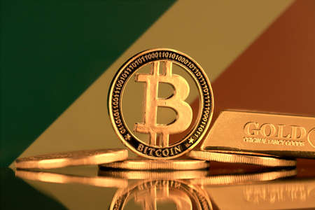 Physical version of Bitcoin, gold bar and Congo Republic Flag.の写真素材